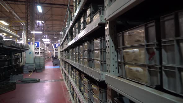 Product Boxes on Shelves in the Factory Corridor 4K
