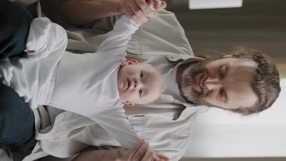 Vertical View Bearded Father Daddy with Little Daughter Son Kid at Home Playing Having Fun Spending