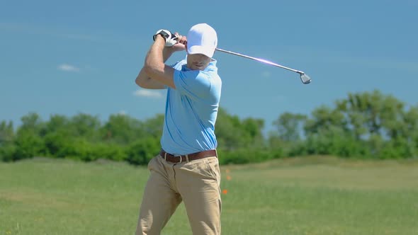 Golf Player Making Swing and Putting Ball Into Hole, Happy With Victory, Slow-Mo