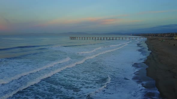 Aerial drone uav view of a pier, beach and ocean.