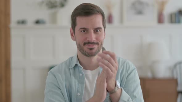 Portrait of Happy Young Man Clapping Applauding People