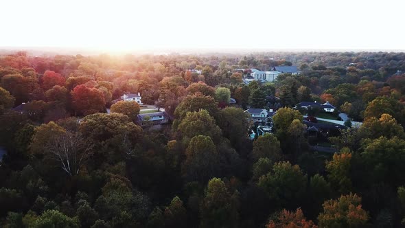 4k Aerial View of Drone Flying above the stunning colorful treetops in Louisville on Autumn Morning