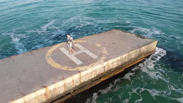 Cyborg Woman Stands On A Helipad