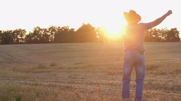 Happy Farmer Dancing Enjoying in the Field at Sunset
