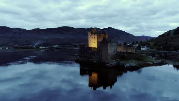Pan Around of a Castle on Donan Isle and Clouds Reflecting on the Loch