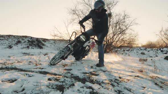 Motorcyclist Doing Tire Burnout in the Snow Field Slow Motion