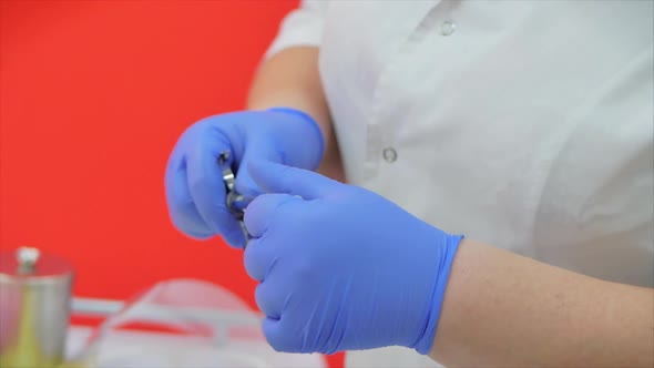 Female Nurse Fills Syringe with Injection for Patient.