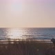Young woman walking on the beach at sunset - VideoHive Item for Sale
