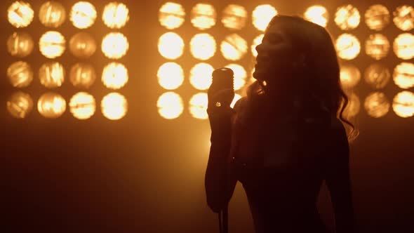 Blonde Vocalist Singing Passionate Song on Stage Closeup