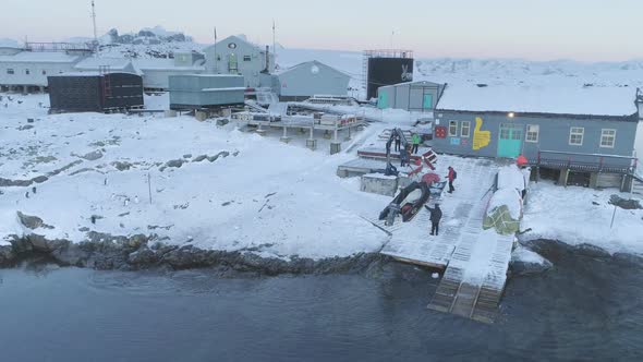People Work on Pier of Antarctic Polar Station  Vernadsky