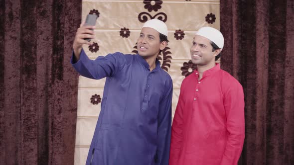 2 Muslim man clicking selfies on Eid