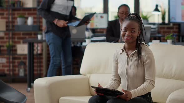 Portrait of Business Woman Sitting on Couch to Work on Digital Tablet