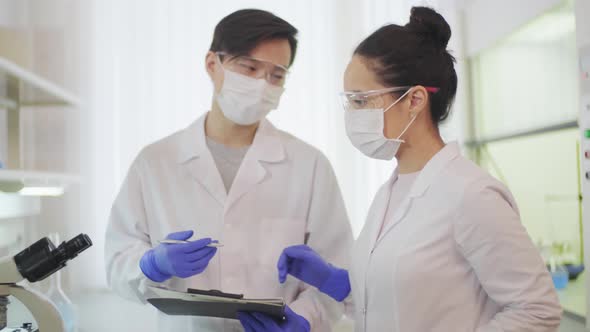 Doctor Video Footage - Two Scientist In Discussion About Work In The Laboratory