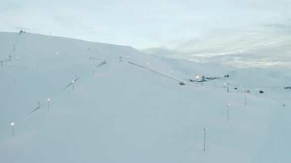 Aerial View of Bláfjöll Ski Resort In Iceland beautiful empty snowy mountain, orbit