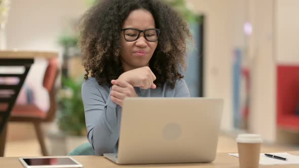 Young African Woman with Laptop Having Wrist Pain