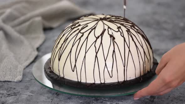 Pouring Melted Chocolate on Top of a Cake. Pancho Cake with Pineapple and Sour Cream Topped with