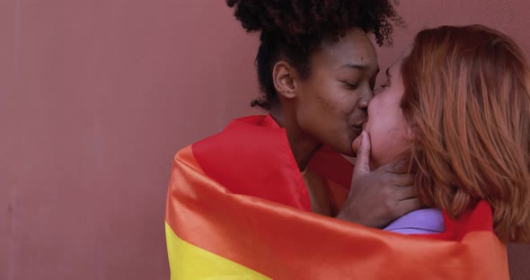 Young lesbian couple having tender moment together - LGBT pride concept