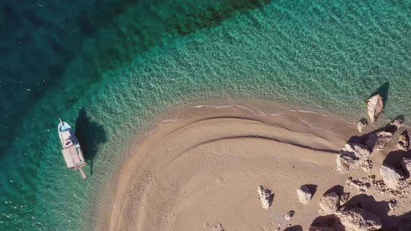 Top View of Beautiful Sandy Beach with Turquoise Sea Water and Boat