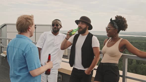 Friends Having Conversation on Rooftop Terrace