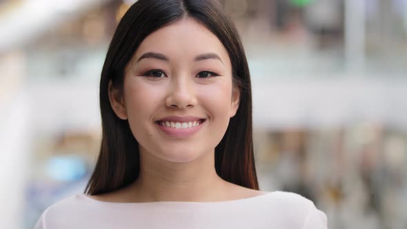 Asian Headshot Happy Optimistic Millennial Girl 20s Brunette Woman with Natural Makeup Businesswoman