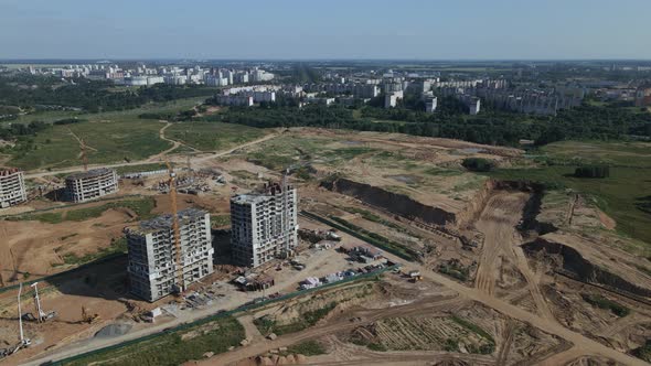 Construction site for a new city block. Construction work is underway.