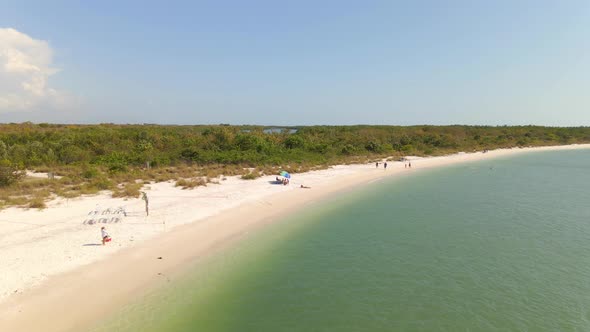 People at the beach in Lovers key, Southwest Florida tropical landscape aerial view
