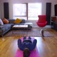 Young male doing home yoga exercise flow indoors, pet cat being inquisitive - VideoHive Item for Sale