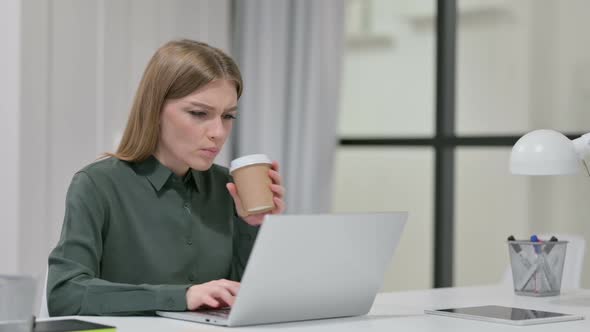 Woman Having Toothache While Drinking Coffee at Work