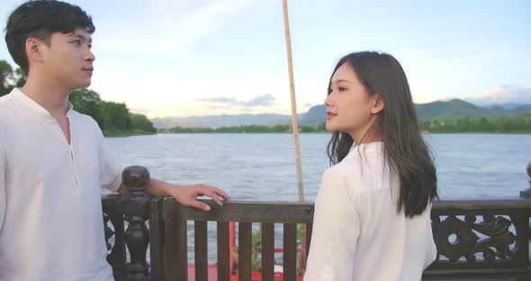 Asian Couple Walking On The Boat And Looking View