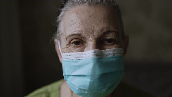 Portrait of Old Woman in Face Mask