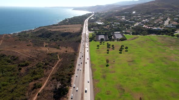 An aerial view of the Pacific Coast Highway and ocean in Malibu, California
