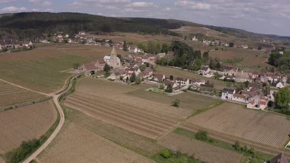 Small village and Fixin Church surrounded by vineyards in famous wine production location Burgundy,