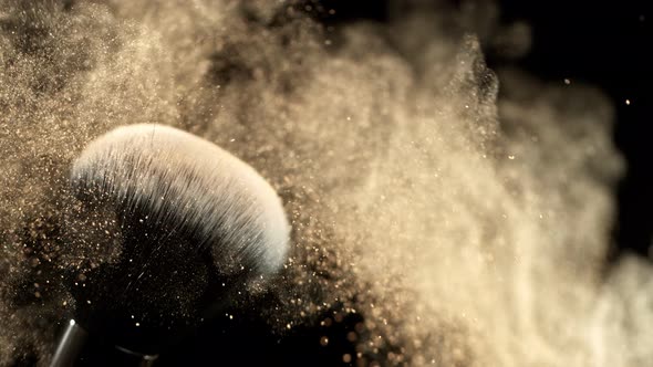 Super Slow Motion Closeup Shot of Makeup Powder Falling From Facial Brush at 1000Fps