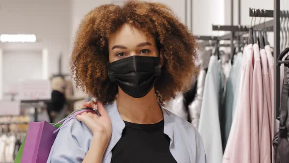 African American Girl Shopper Consumer Buyer Curly Woman Client Wears Medical Protective Mask Walks
