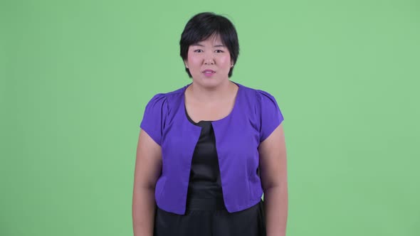 Happy Young Overweight Asian Woman Getting Good News