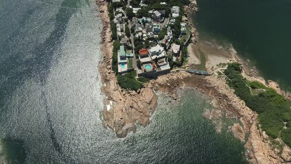 Luxury Villas and Rocky Coast of the Island in Shek O, Hong Kong, Drone View