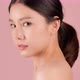 Close up Beauty shot of Beautiful Asian girl looking at camera isolated on pink background - VideoHive Item for Sale