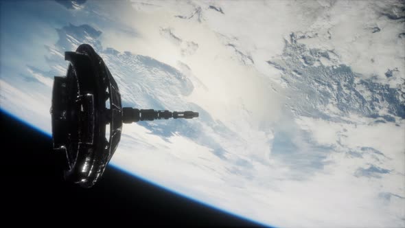 Futuristic Space Satellite Orbiting the Earth alt