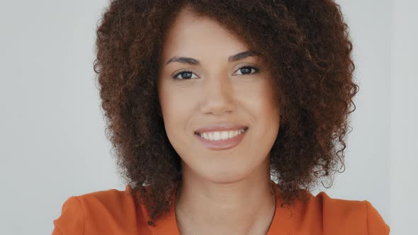 Female Face Closeup Female Portrait Indoor African Latin 30s Smiling Girl Biracial Woman with Curly