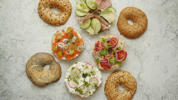 Bagel Sandwiches with Various Toppings, Salmon, Cottage Cheese, Hummus, Ham, Radish and Fresh Herbs