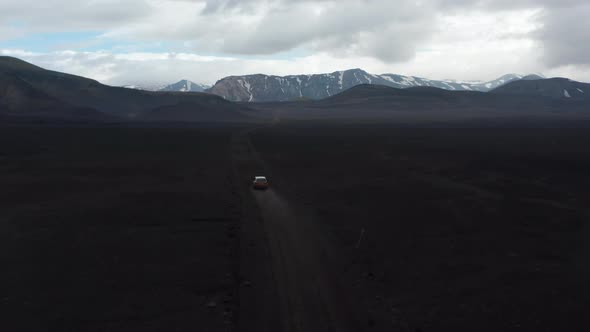 Birds Eye View of Car Driving Offroad Exploring Lakagigar Black Volcanic Desert