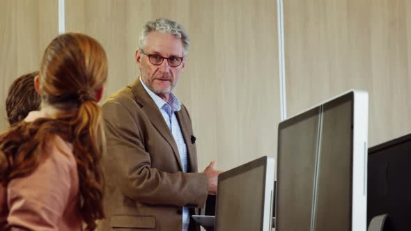 Coworkers applauding a colleague after presentation