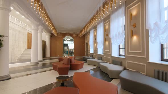 Comfortable Sofas Fairy Lights and Columns in Palace Hallway