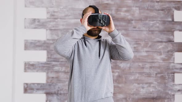 Caucasian Home Designer Using Virtual Reality Goggles