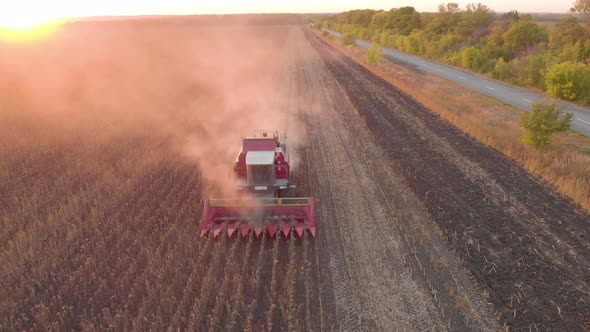 Aerial View Combine Harvesting on Sunflower Field. Mechanized Harvesting Sunflower. Large Field 