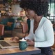 African American Woman Hands in Cafe with Coffee Working on Laptop Typing - VideoHive Item for Sale