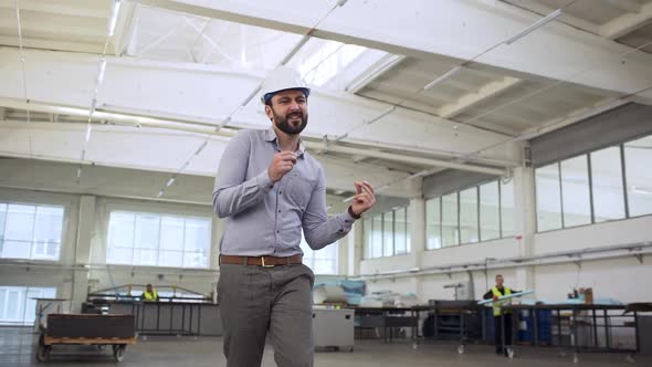 Portrait of Adult Happy Man Head Director or Engineer Wearing Suit and Helmet Rejoicing and Dancing