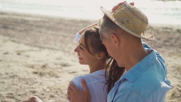 Closeup Portrait Cheerfulness Couple at Seashore Man Touching the Nose to Woman Neck