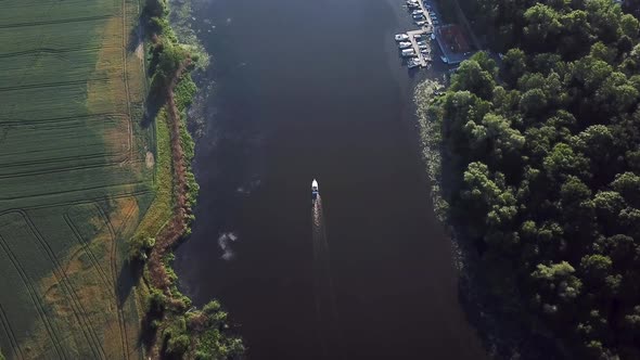 Aerial: boat on the river at dawn