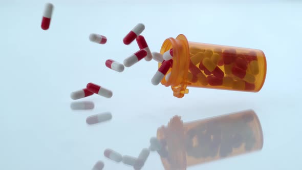 Pills spilling out of bottle in slow motion; shot on Phantom Flex 4K at 1000 fps alt